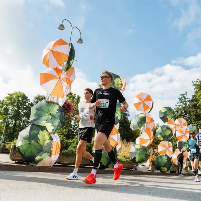 Runners in a scenic outdoor setting